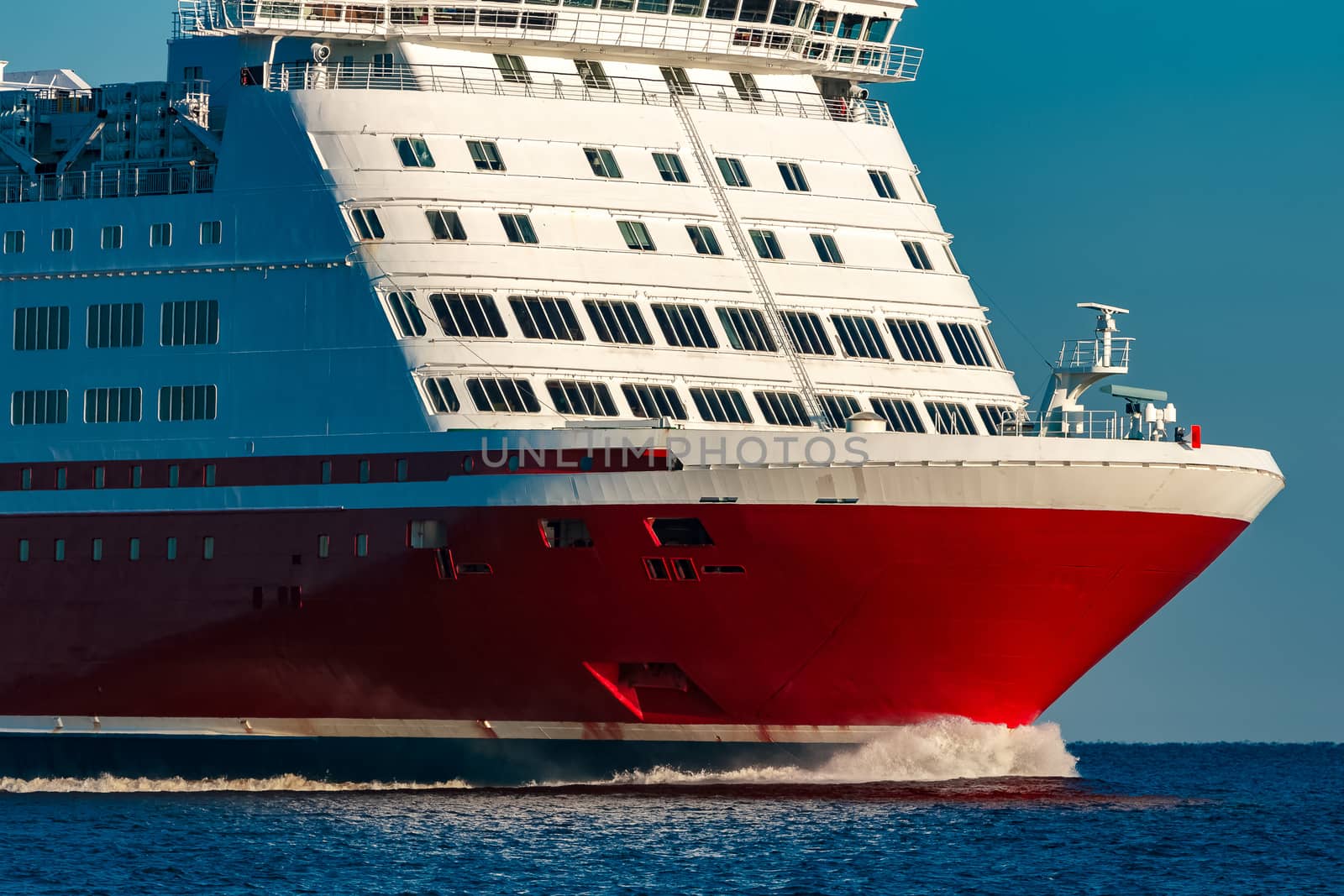 Red cruise liner. Large passenger ferry underway