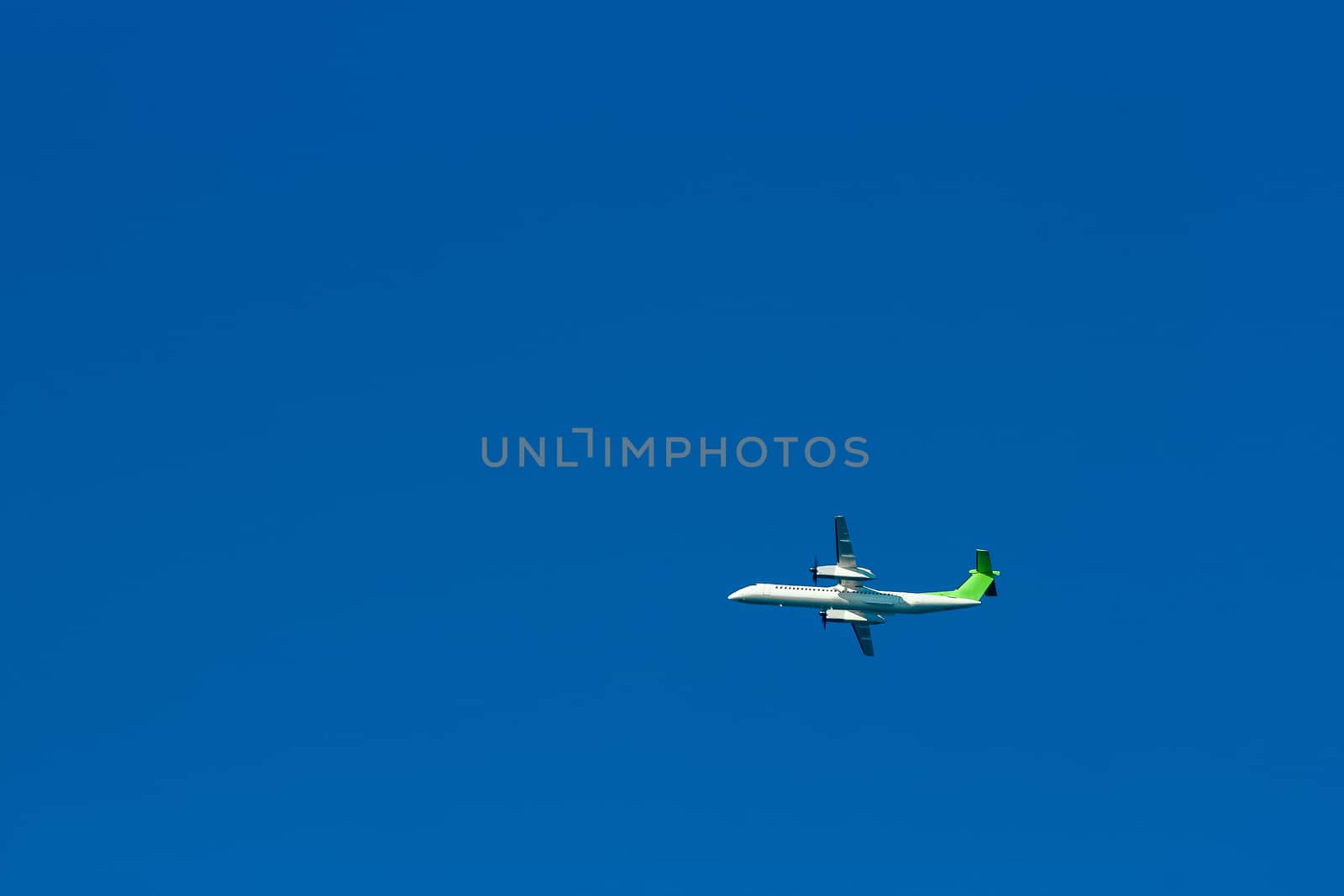 Passenger aircraft flying in the blue sky