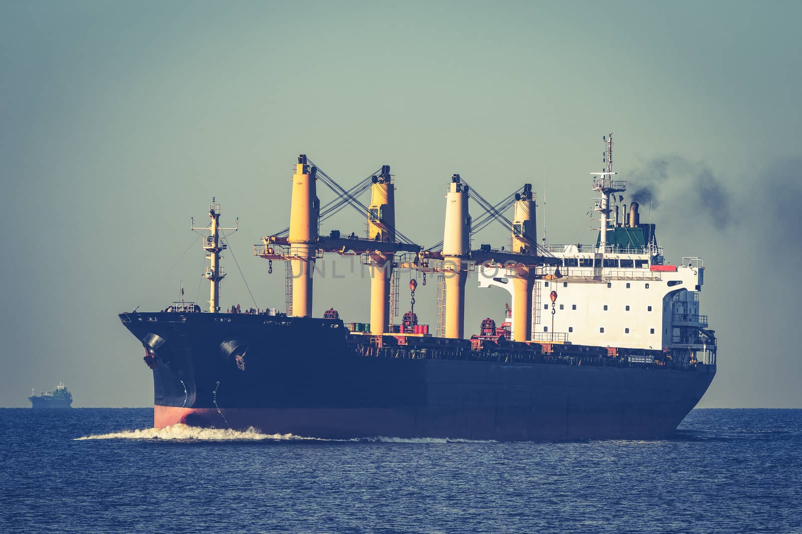 Black cargo ship sailing from the Baltic sea