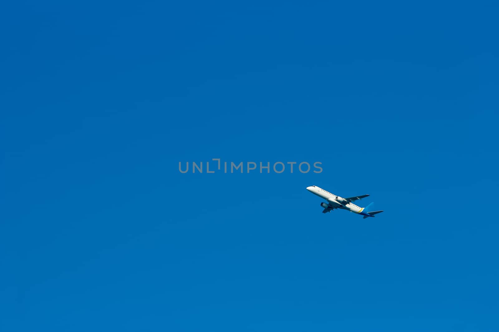 Passenger aircraft flying in the blue sky