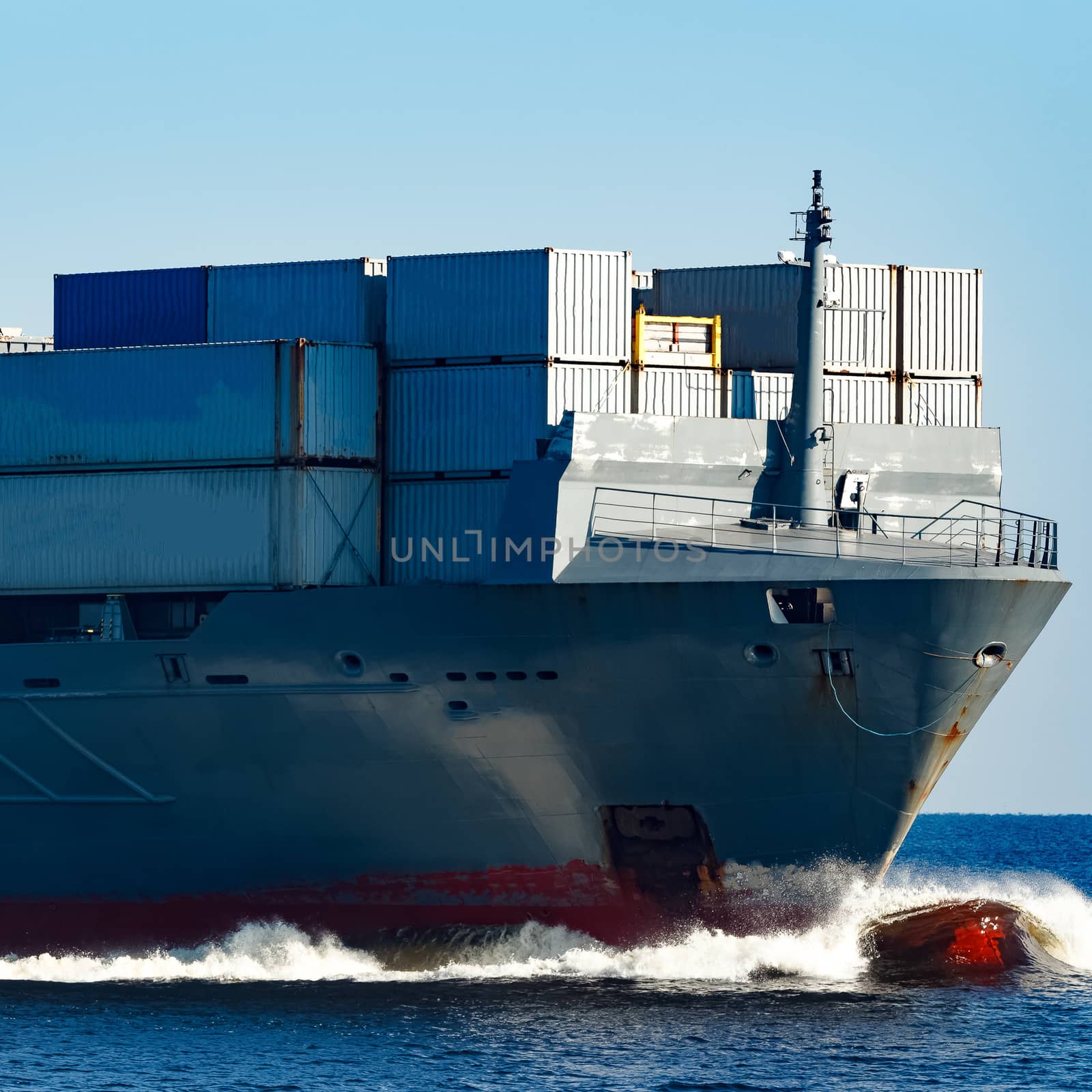 Large grey container ship moving from Baltic sea