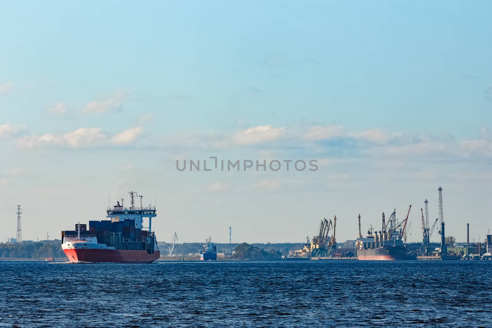 Red container ship sailing to the Baltic sea