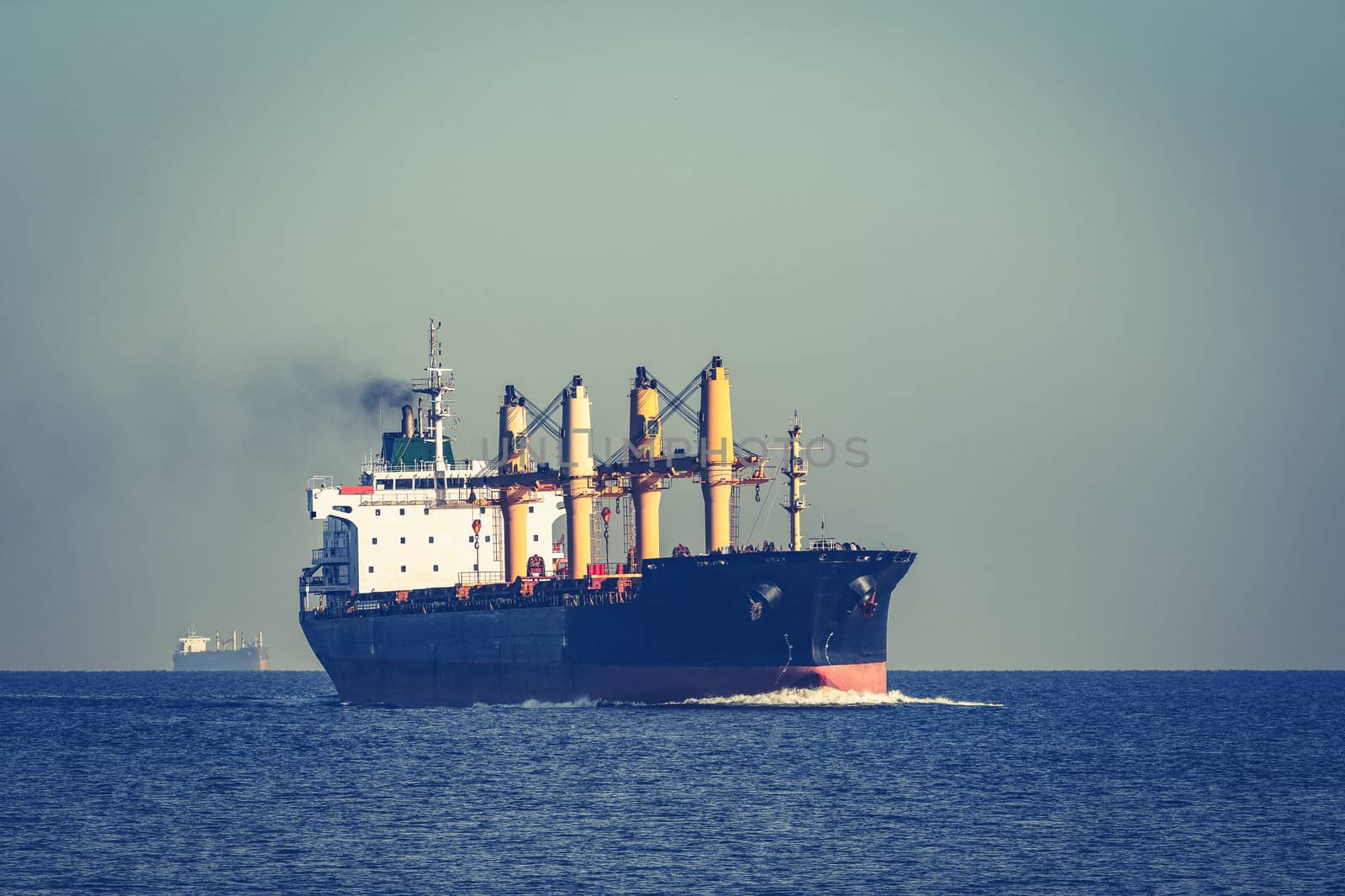 Black cargo ship sailing from the Baltic sea