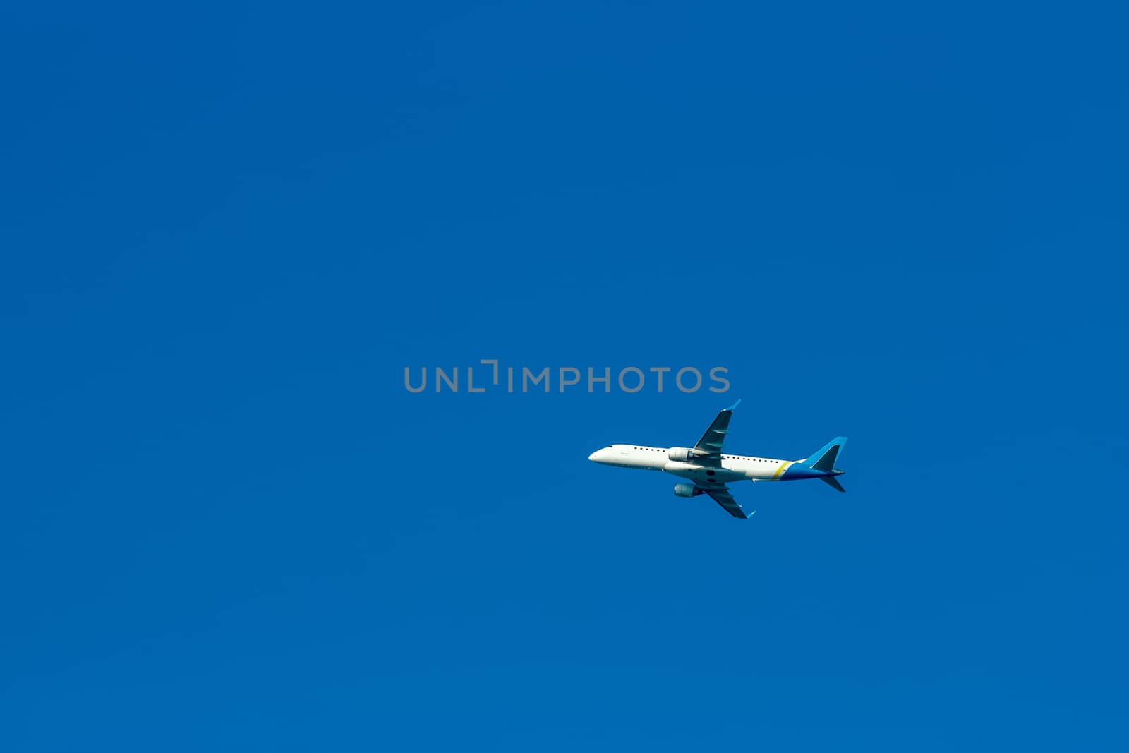 Passenger aircraft flying in the blue sky