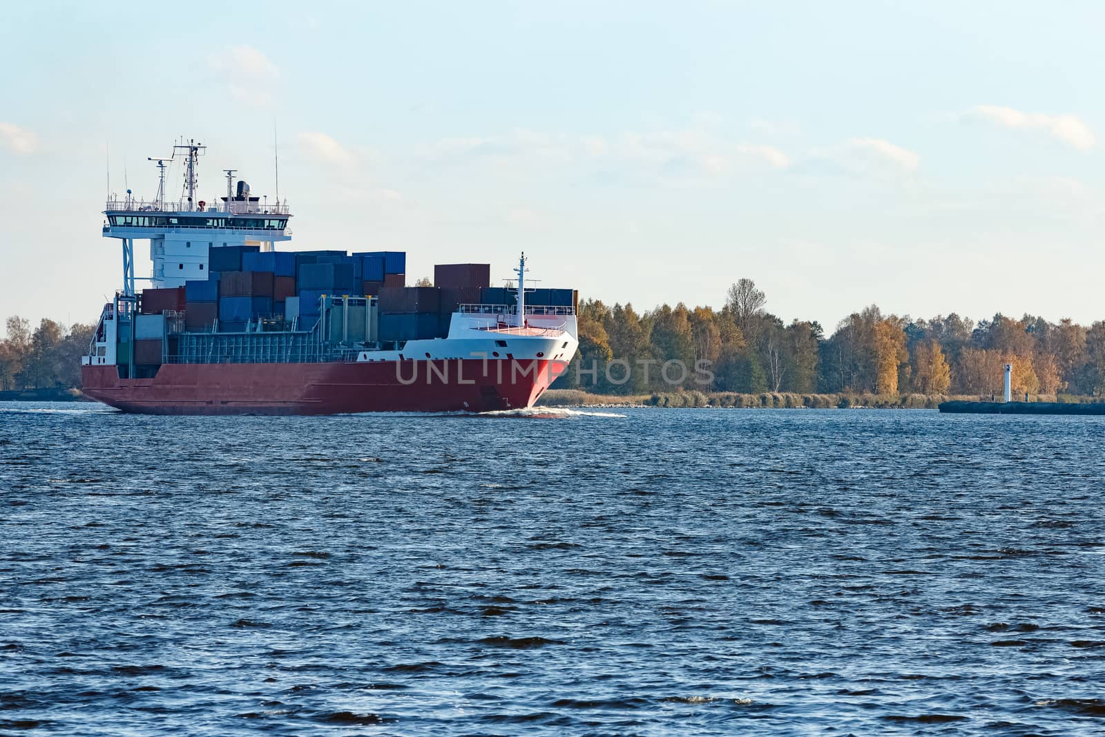 Red container ship sailing to the Baltic sea
