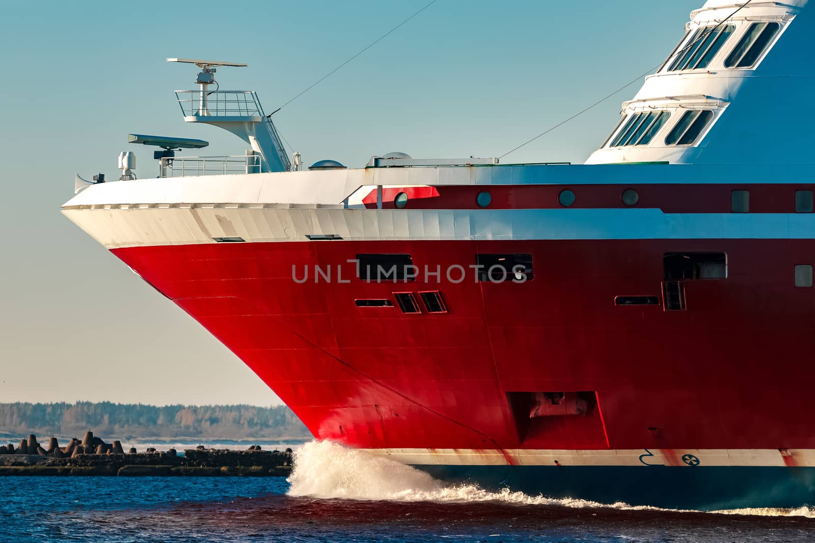 Red cruise liner. Large passenger ferry underway