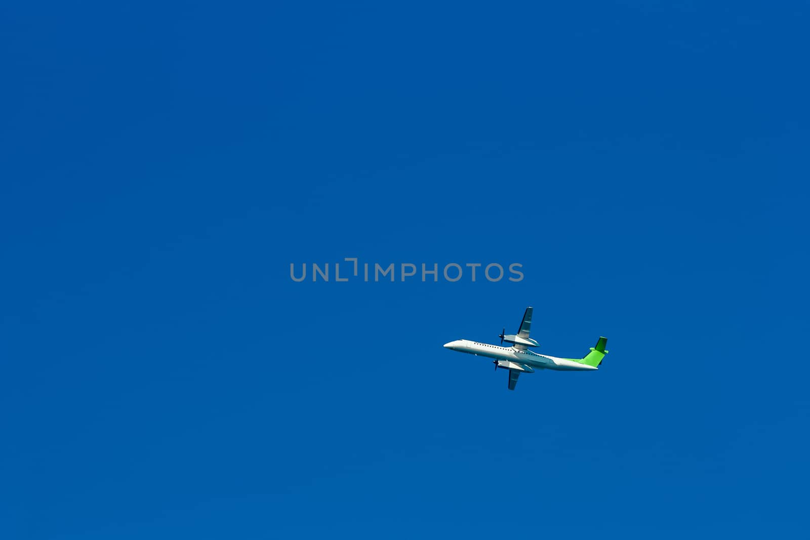 Passenger aircraft flying in the blue sky
