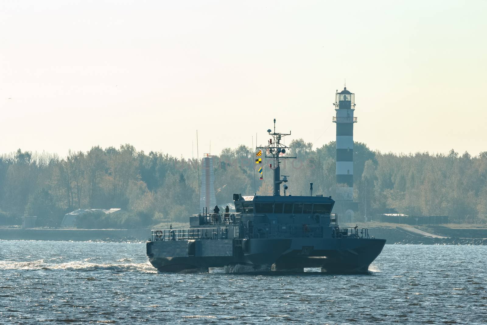 Small grey military ship moving from Baltic sea