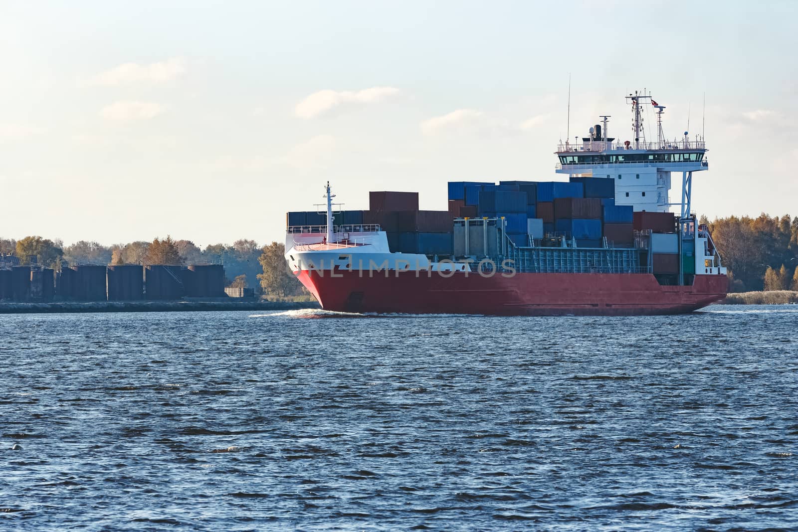 Red container ship sailing to the Baltic sea