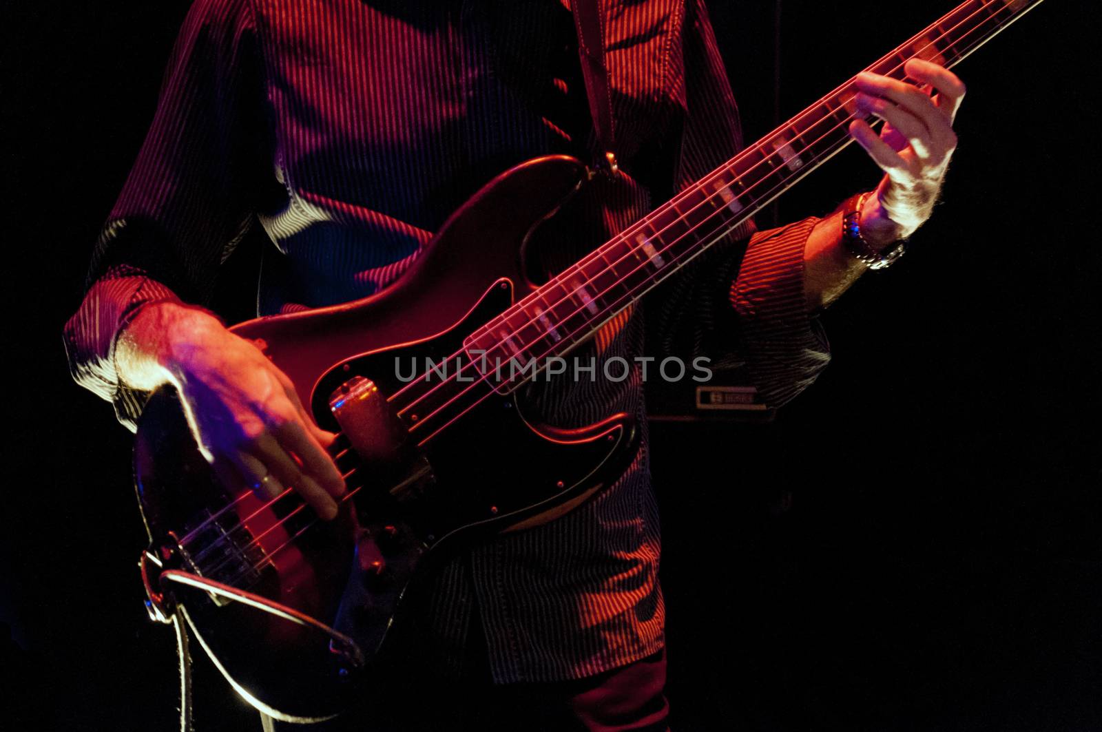 bass guitar player live on stage