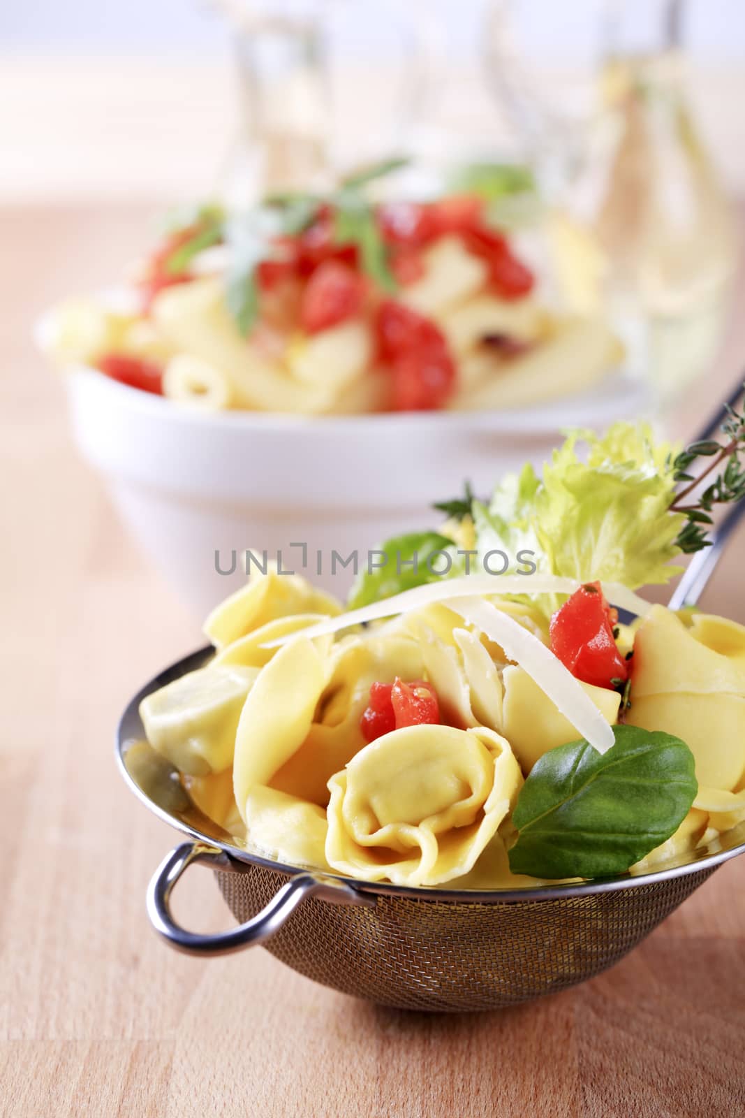 Cooked stuffed pasta in a metal sieve 
