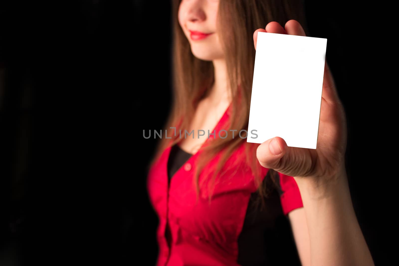 attractive girl with playing card. red dress and lips