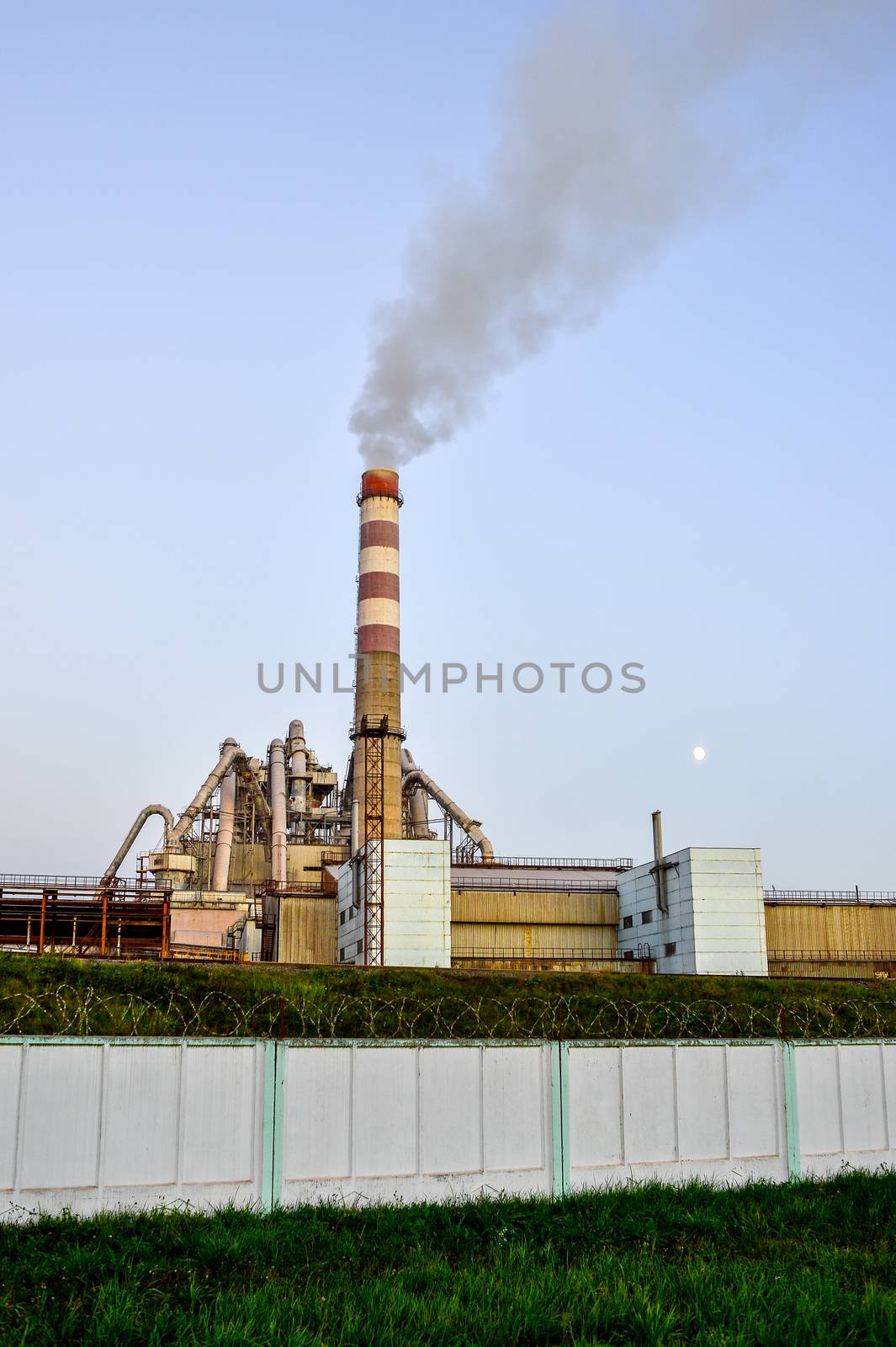 Pollution of atmospheric air from the chimneys of plants.