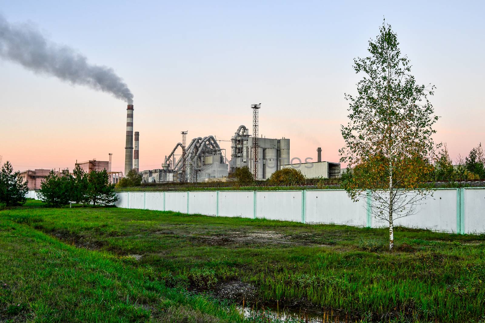 Pollution of atmospheric air from the chimneys of plants.