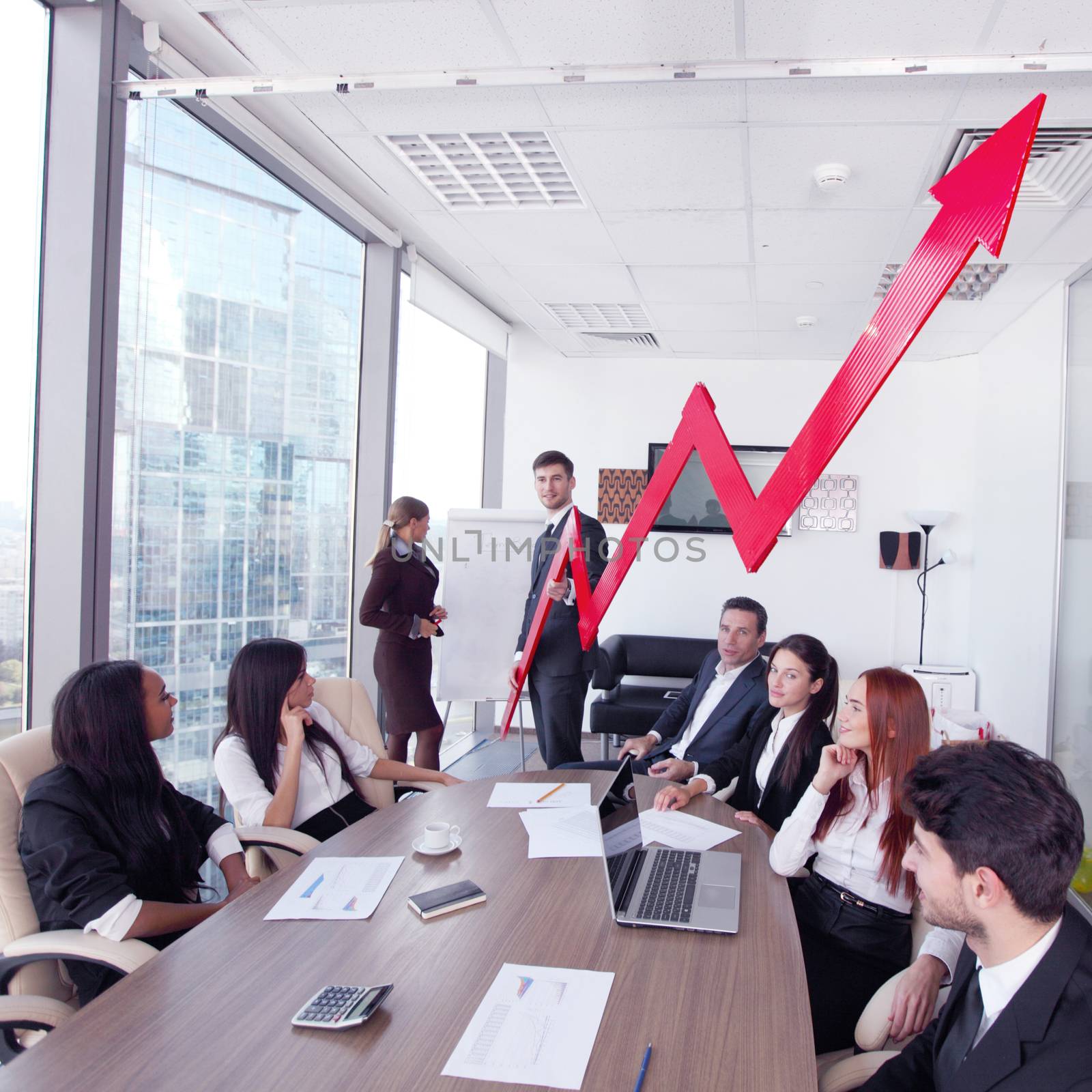 Business people discuss red arrow of income growth at meeting