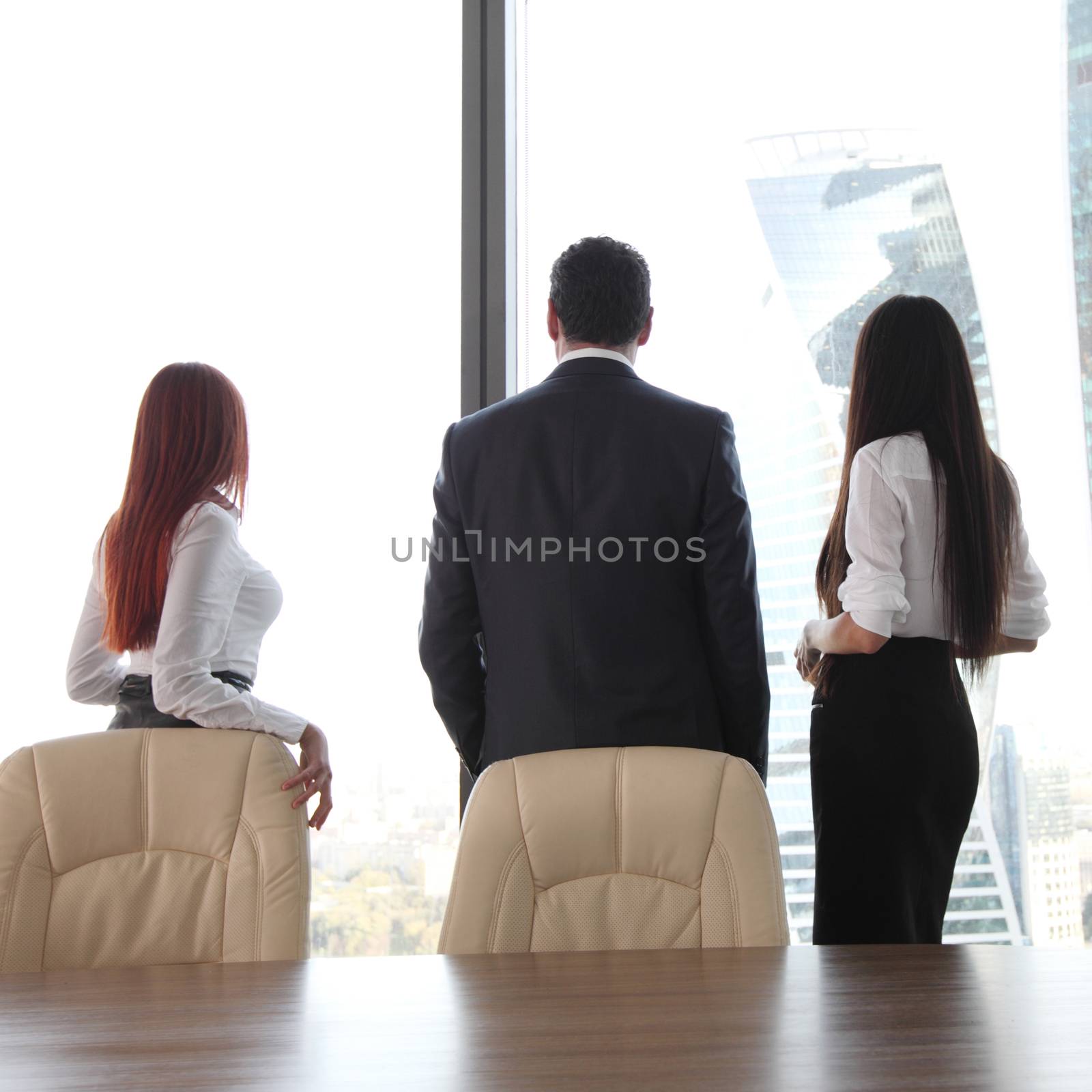 Rear view of business people looking at window