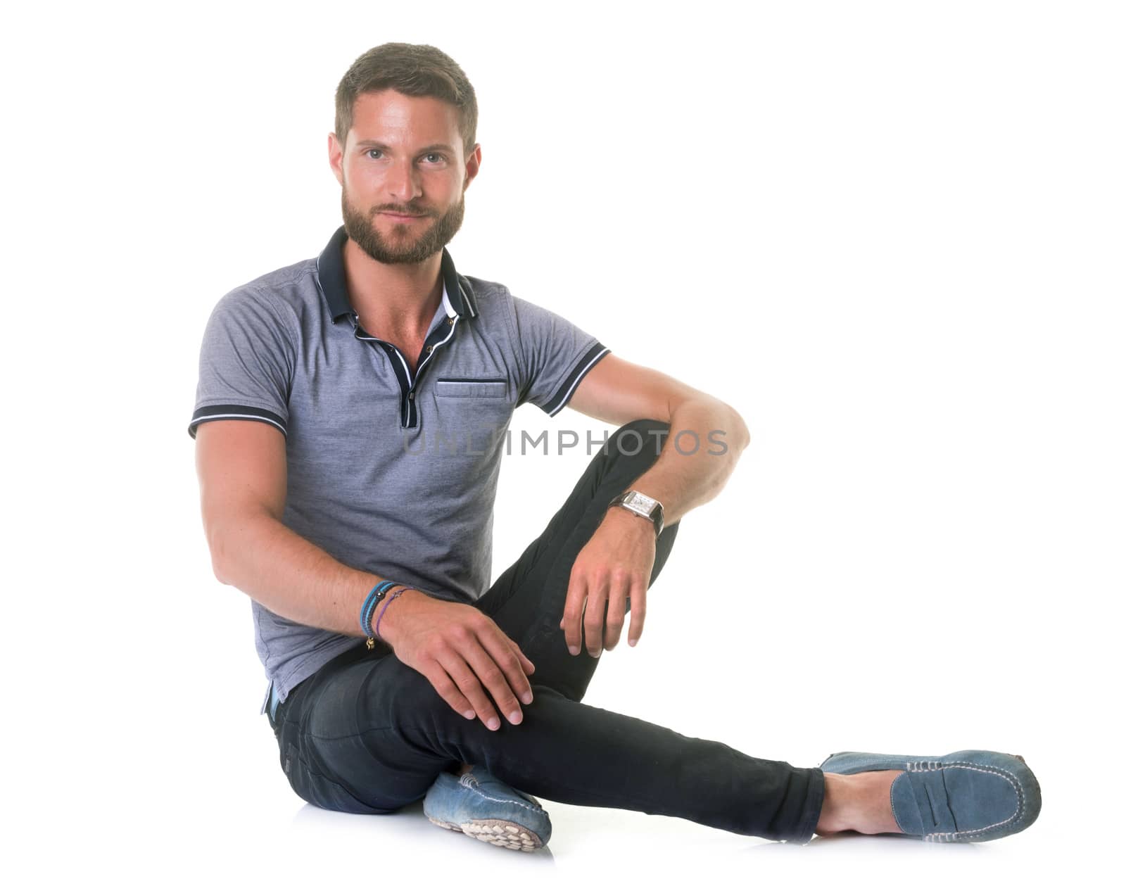 young bearded man in front of white background