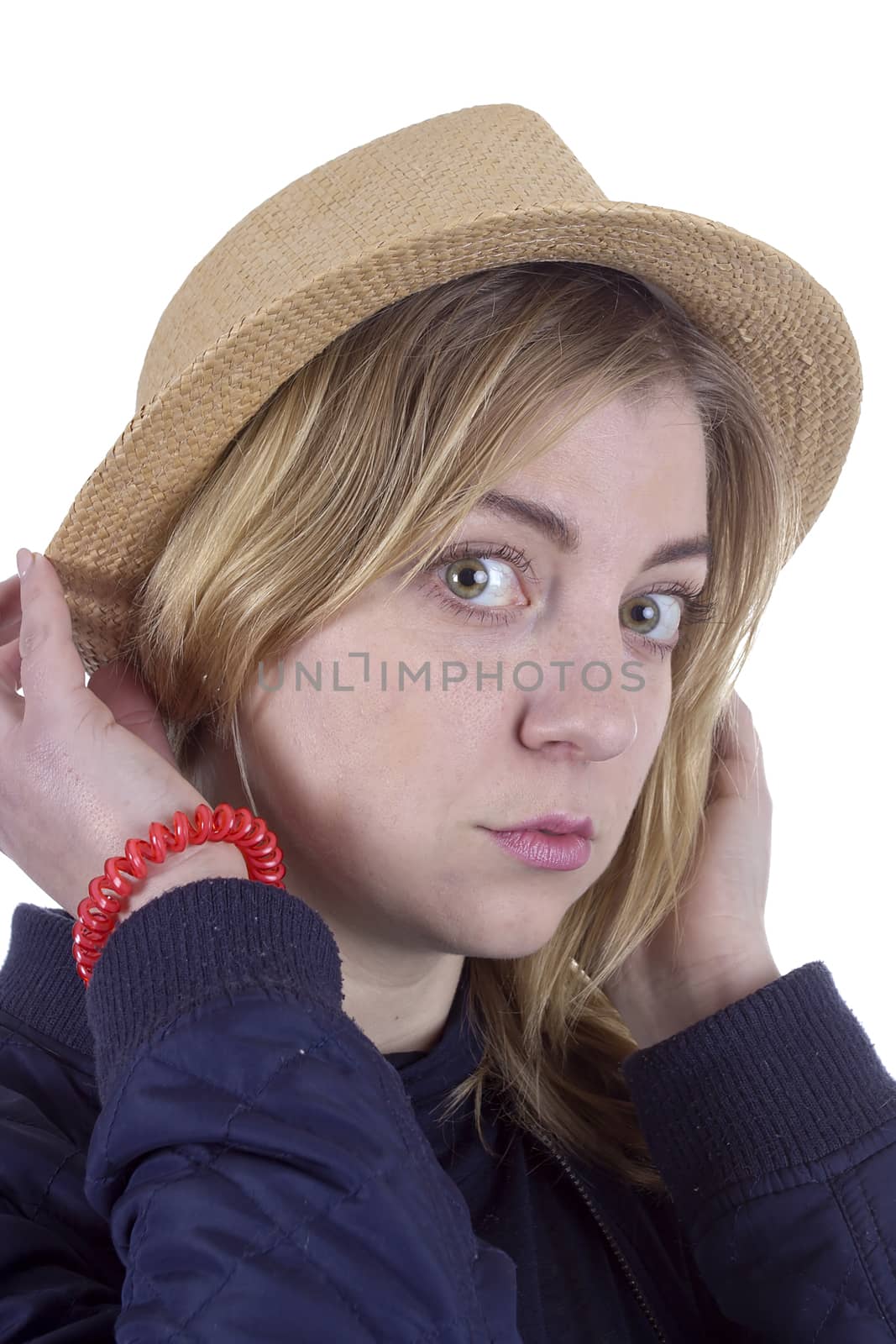 Portrait of a young blonde woman in a straw hat