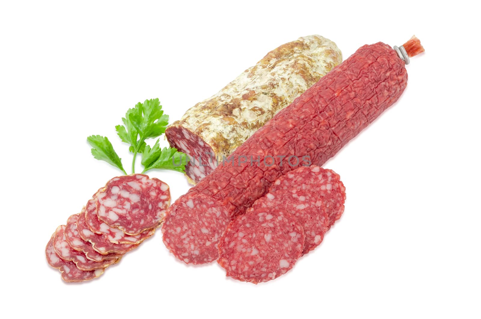 Partly sliced two different salami and parsley twig by anmbph