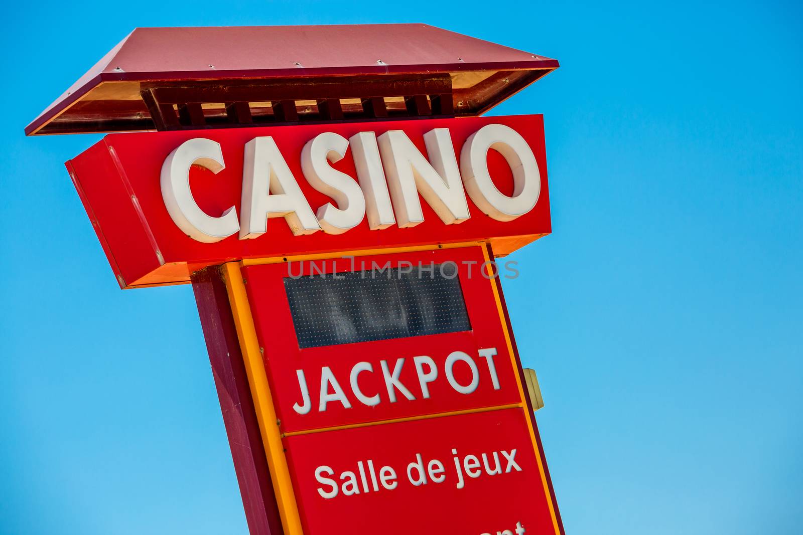 Casino sign on blue sky background
