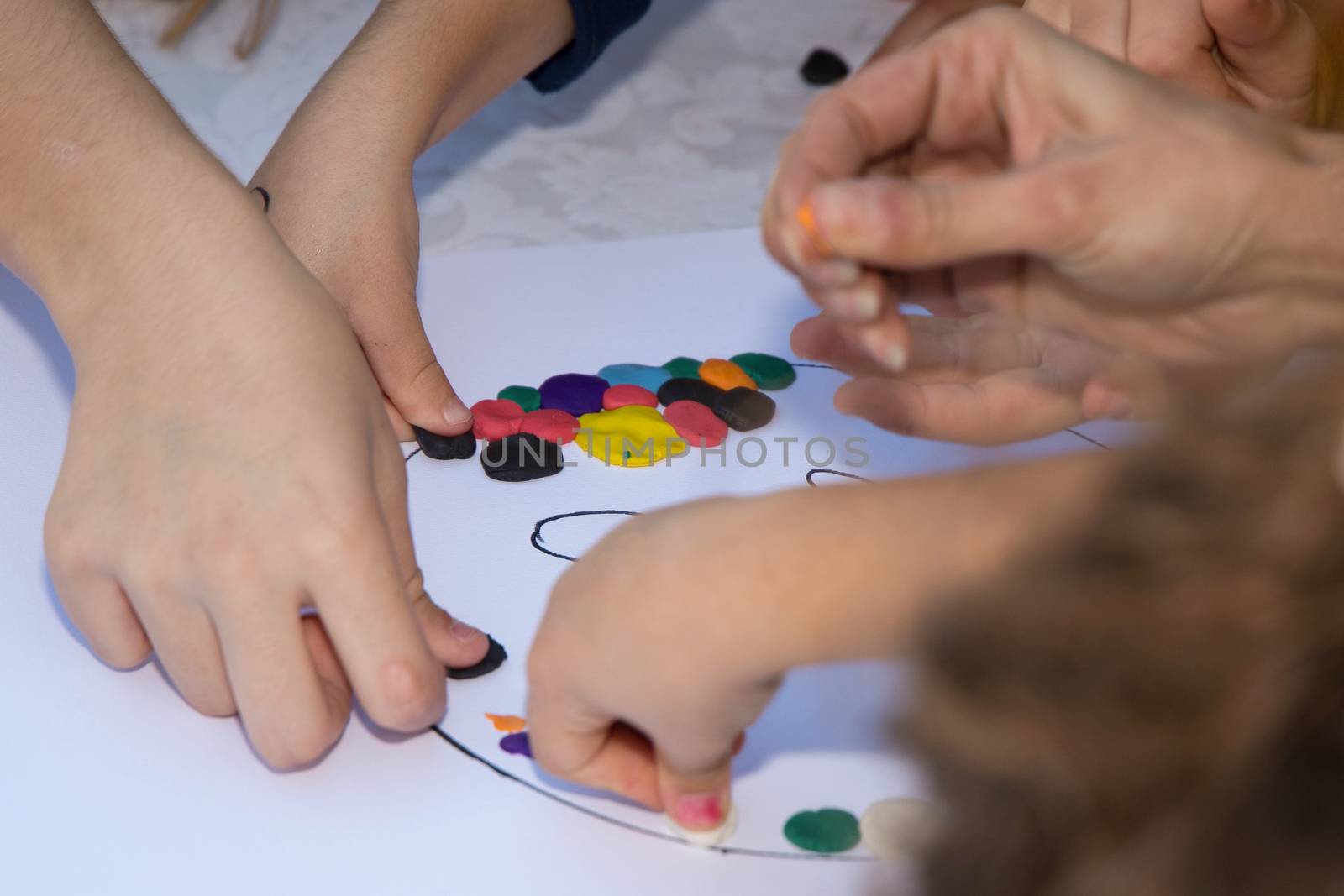 Kids playing with plasticine