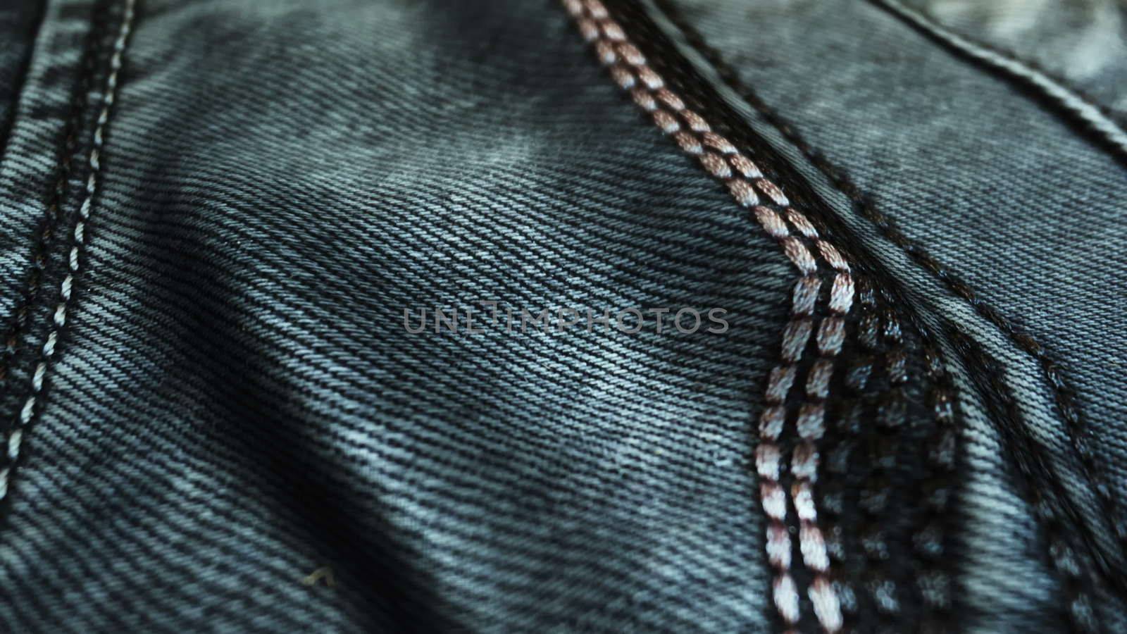 Realistic jeans waving in the wind. Abstract background Ultra-HD resolution. Close-up fabric texture. Seamless loop.