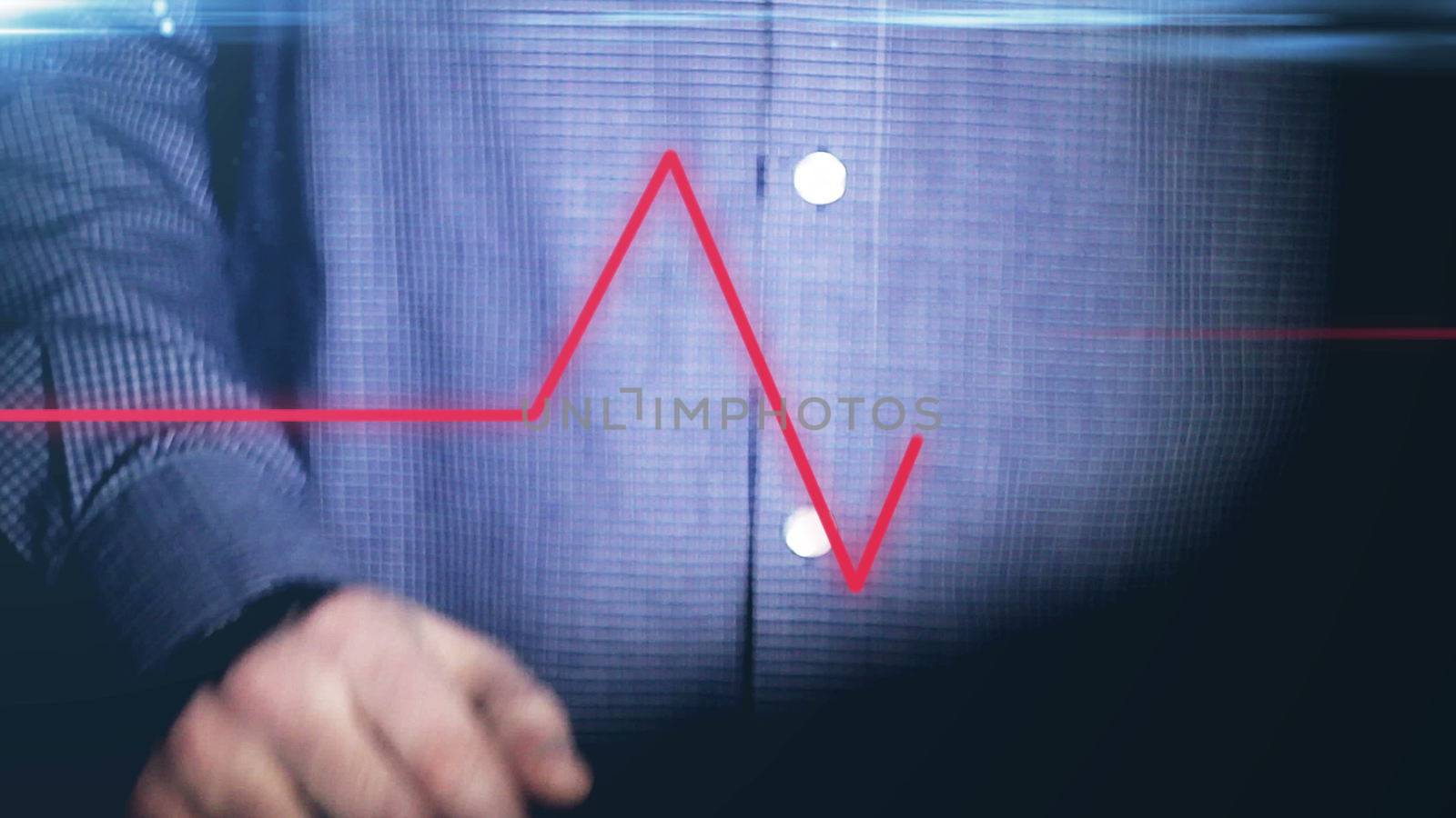 Businessman working on holographic interface. Financial. Blue. Man touching a visual screen with holographic computer icons. Financial diagrams appearing. More color options in my portfolio. pulse