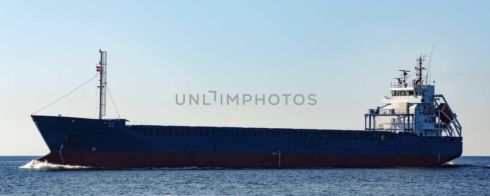 Blue cargo ship sailing from the Baltic sea