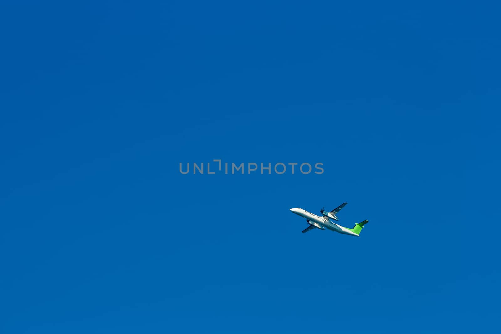 Passenger aircraft flying in the blue sky