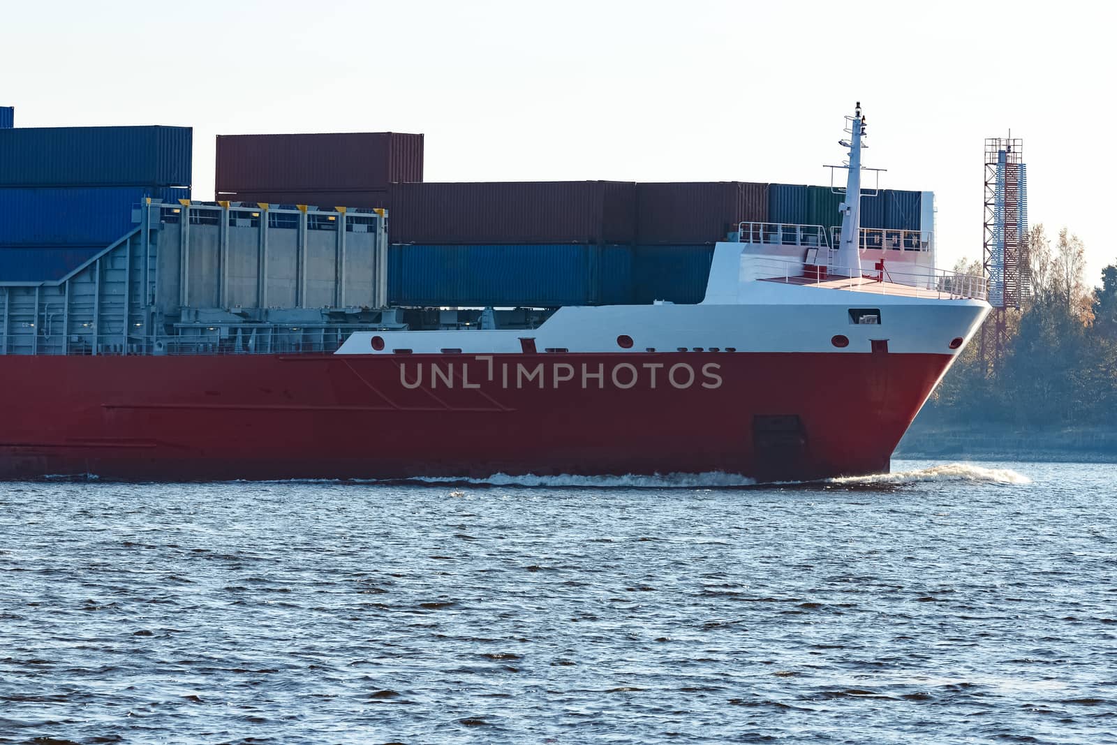 Red container ship sailing to the Baltic sea