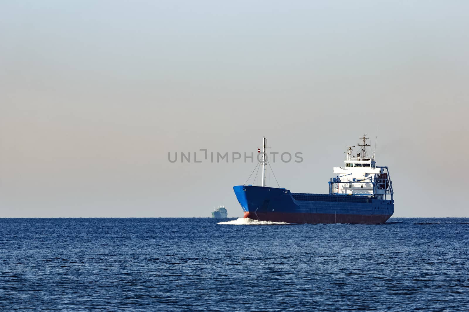 Blue cargo ship sailing from the Baltic sea
