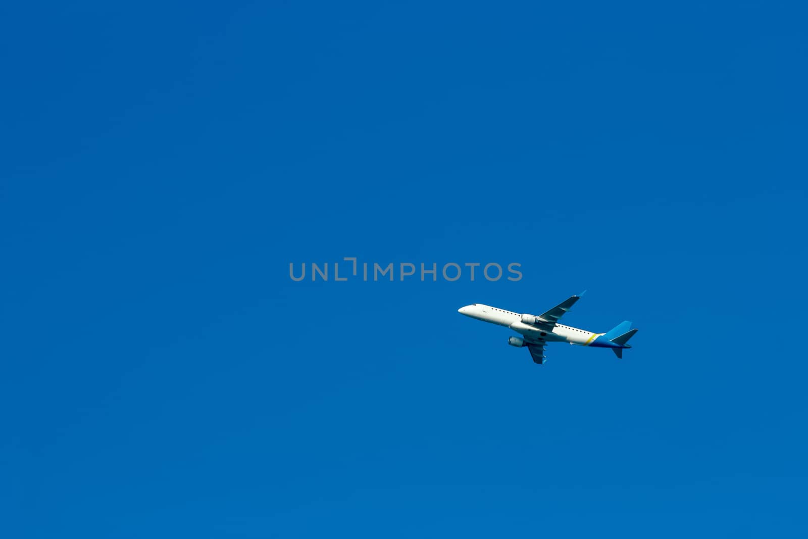Passenger aircraft flying in the blue sky