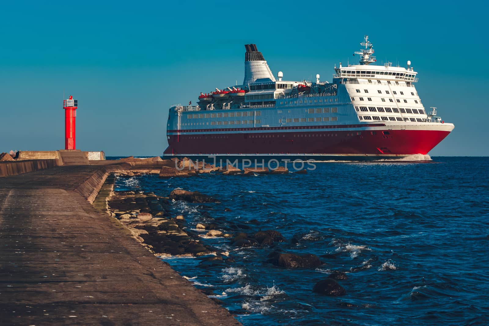 Red cruise liner. Large passenger ferry underway
