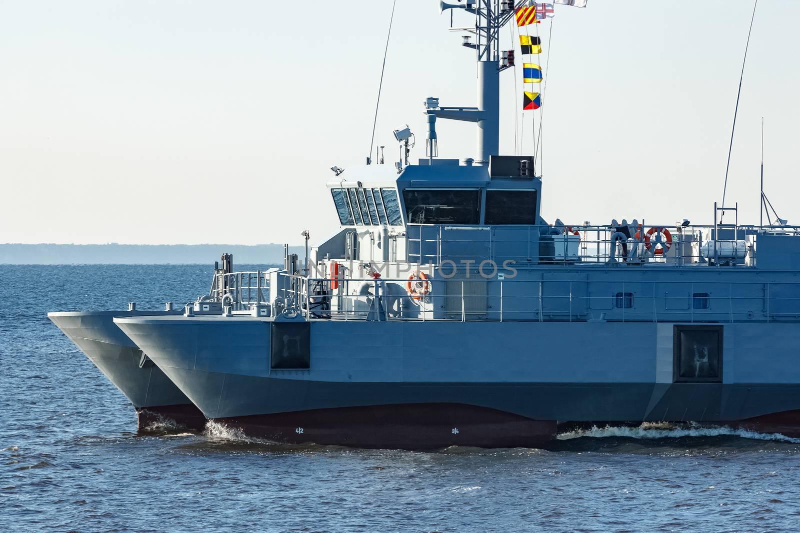 Small grey military ship moving from Baltic sea