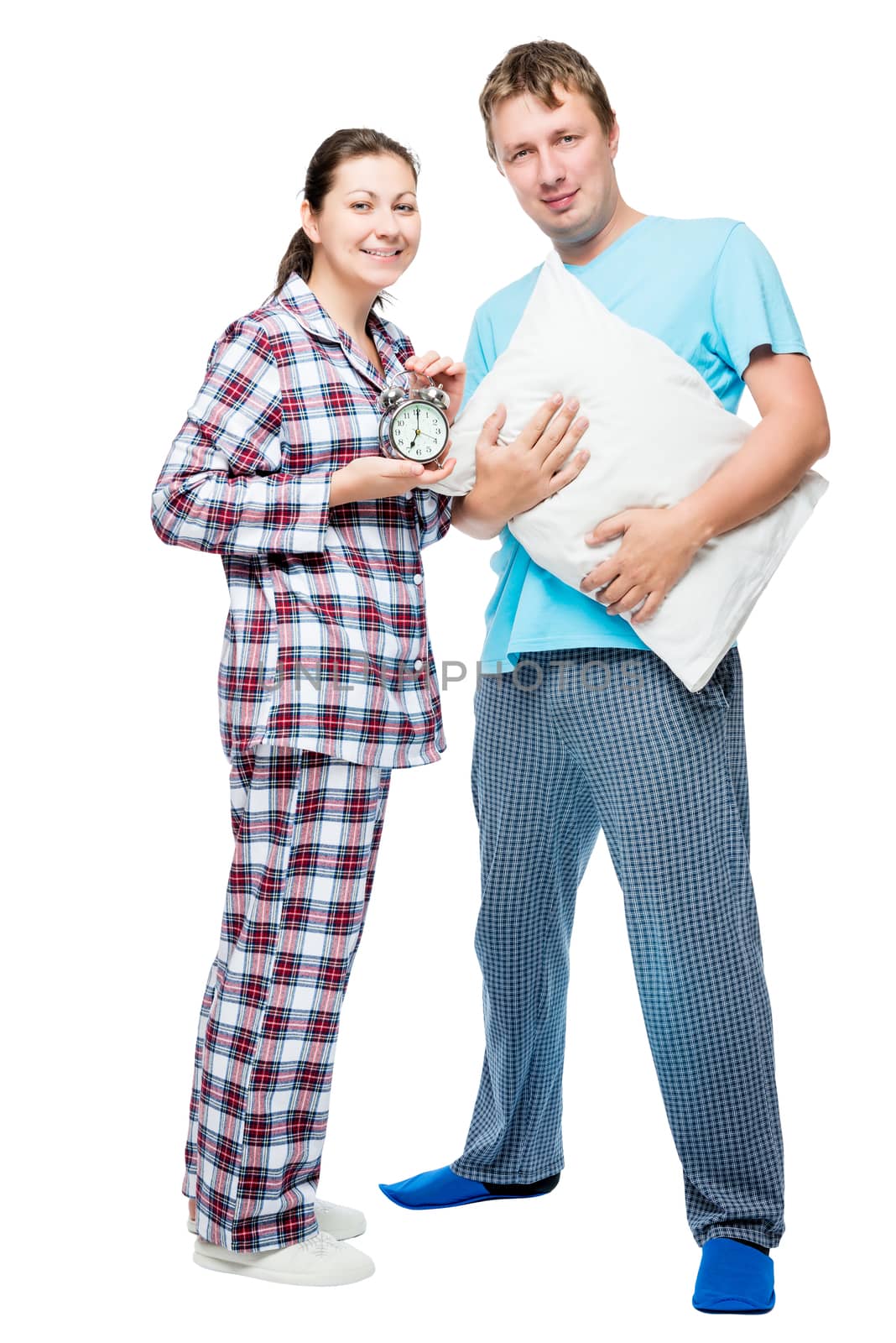 Husband and wife in pajamas on white background posing in studio by kosmsos111