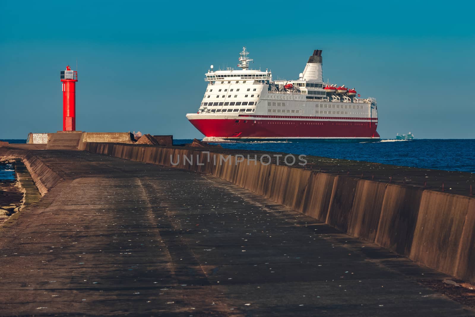 Red cruise liner. Large passenger ferry underway