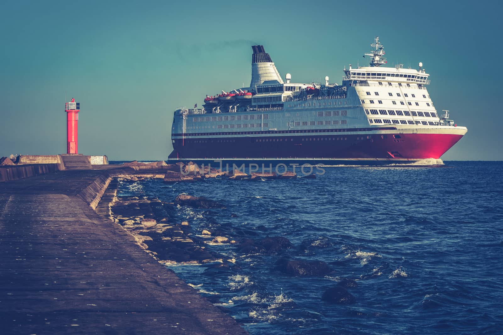 Red cruise liner. Large passenger ferry underway