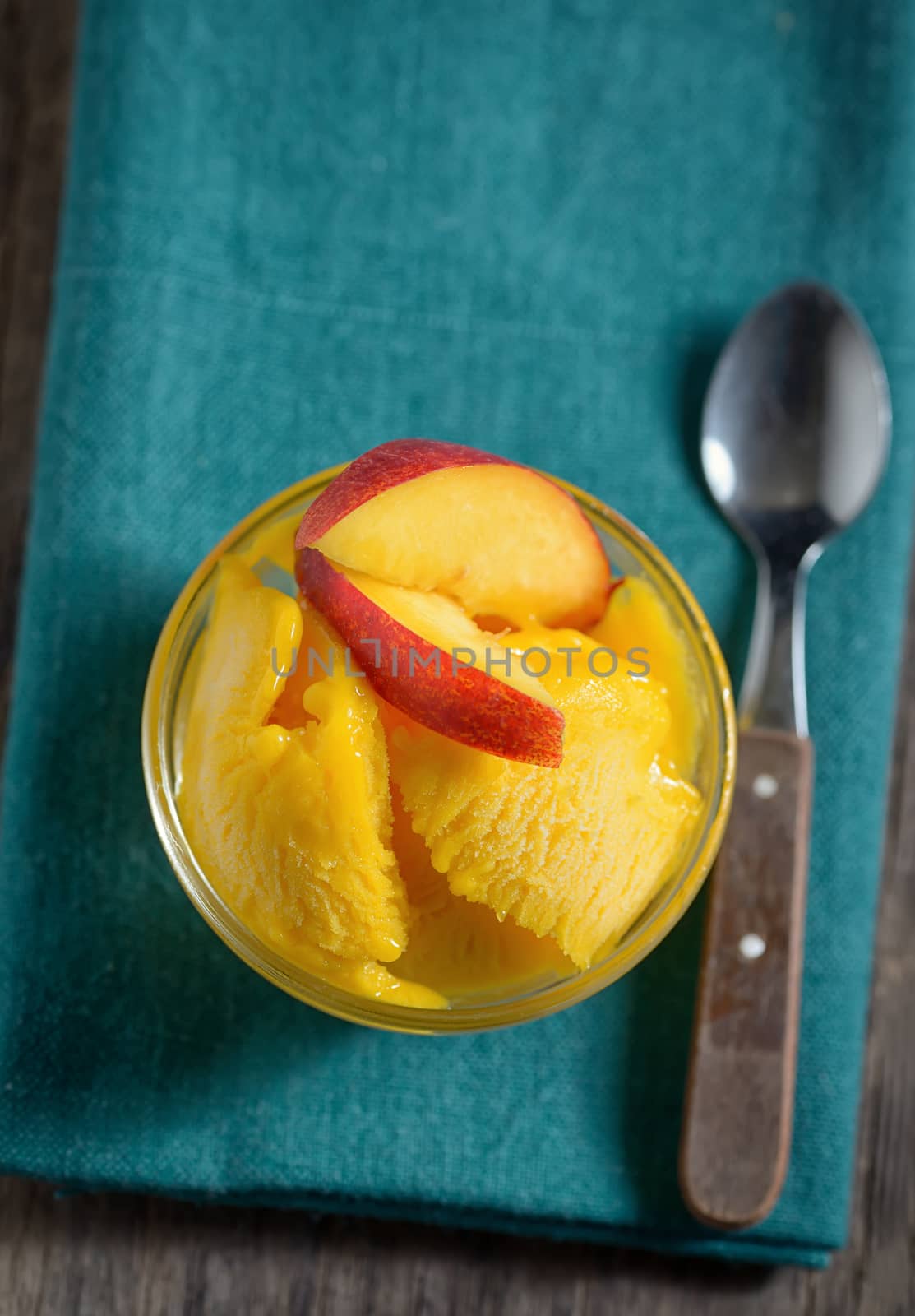 Home made mango ice sorbet with peach slices