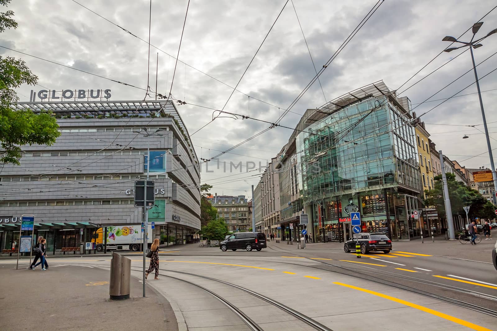 Zurich, Switzerland - June 10, 2017: Inner-city of Zurich with old and modern buildings. Tram rails in front.