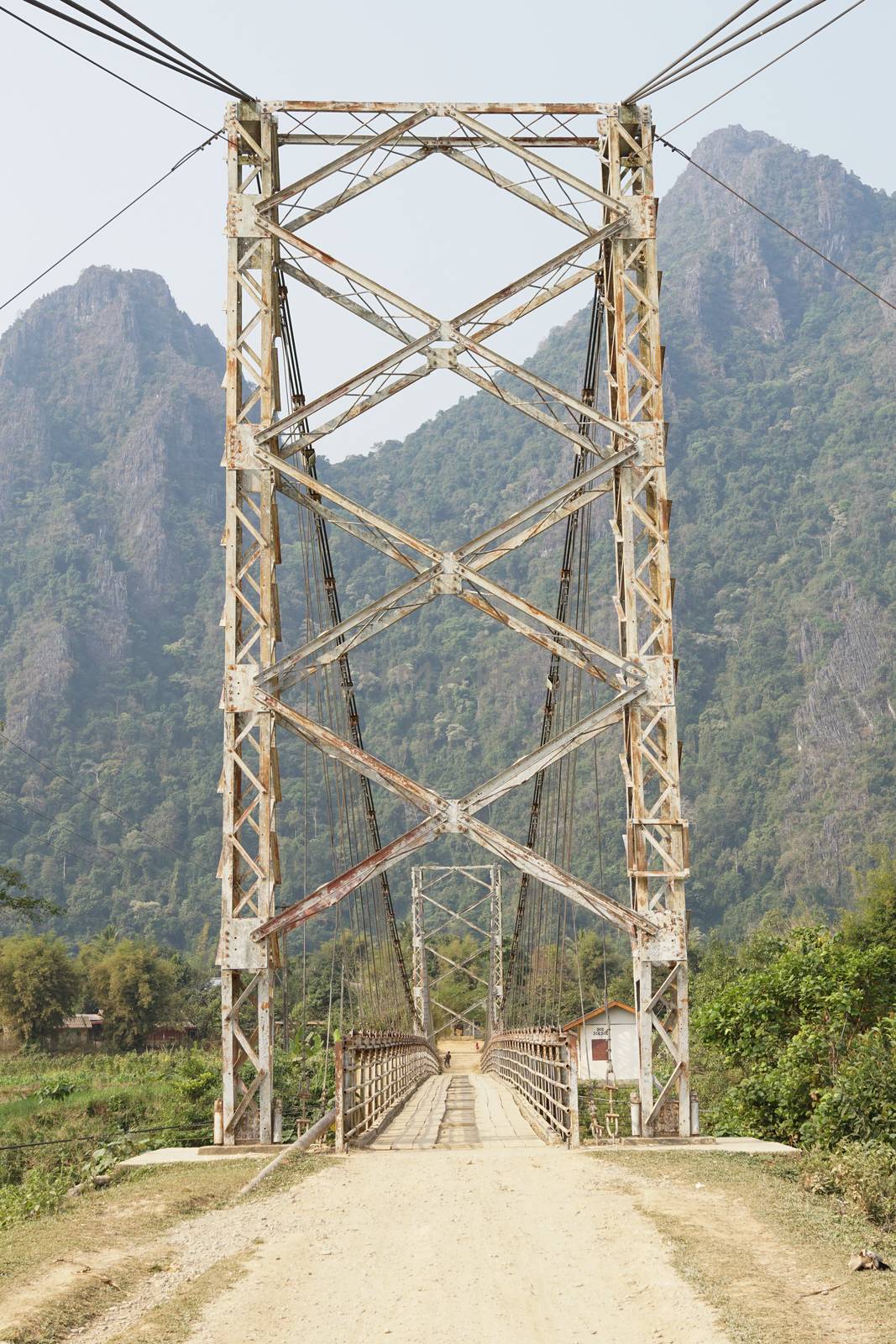 Old chain bridge crossing a river close to Vang Vieng, Laos, Asia