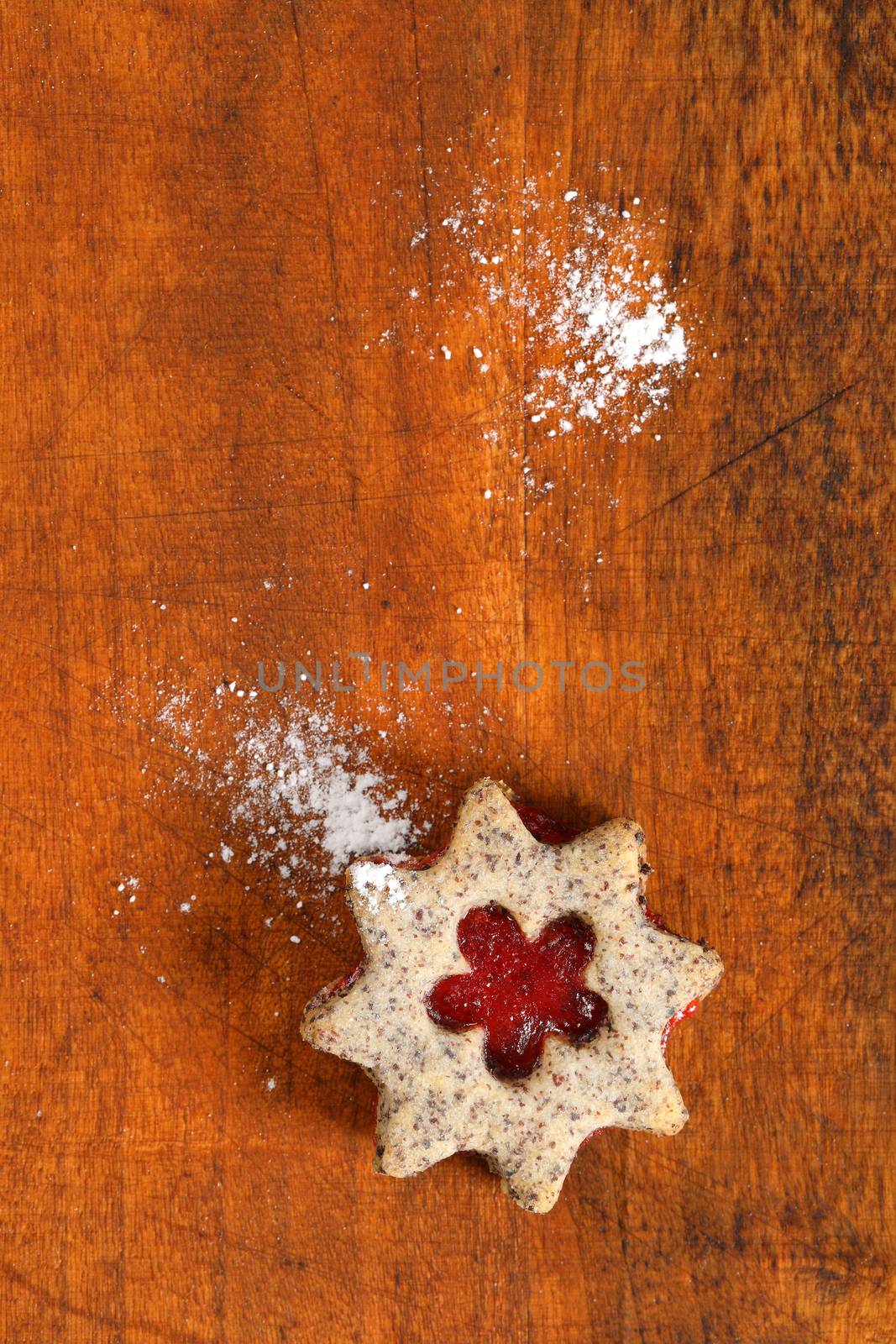 shortbread cookie with jam filling on wooden background