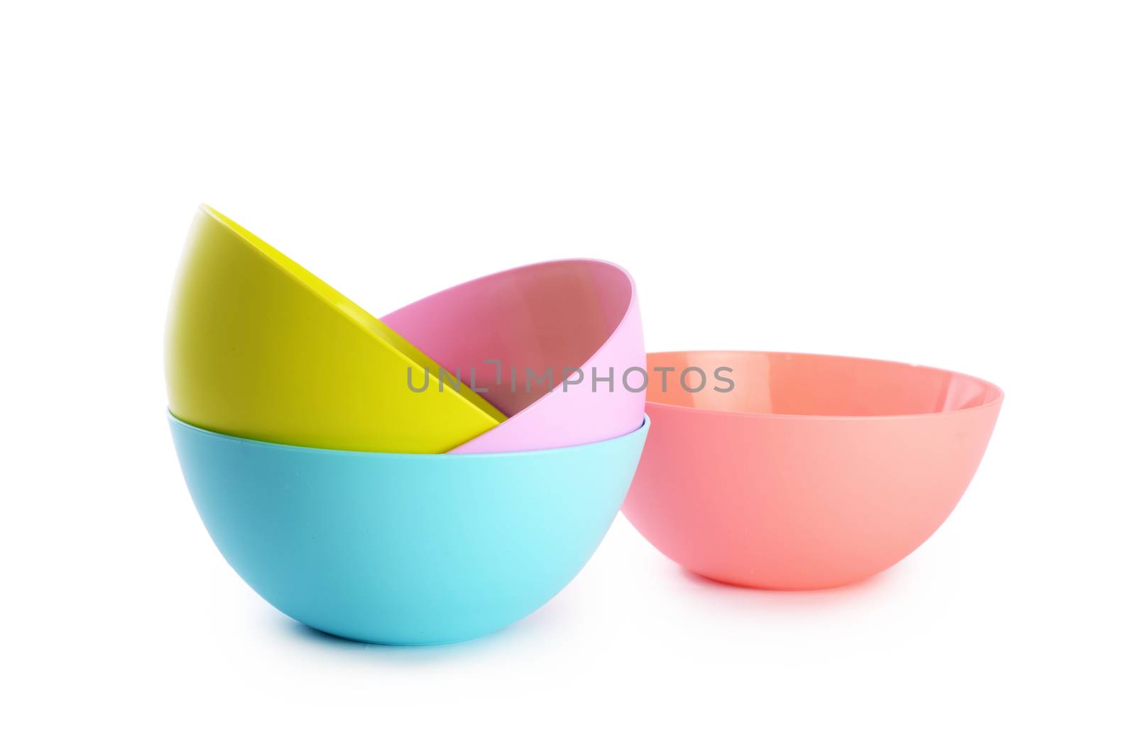 Plastic colorful plates isolated on white background