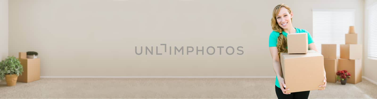 Banner of Happy Young Adult Woman Holding Moving Boxes In Empty Room In A New House.