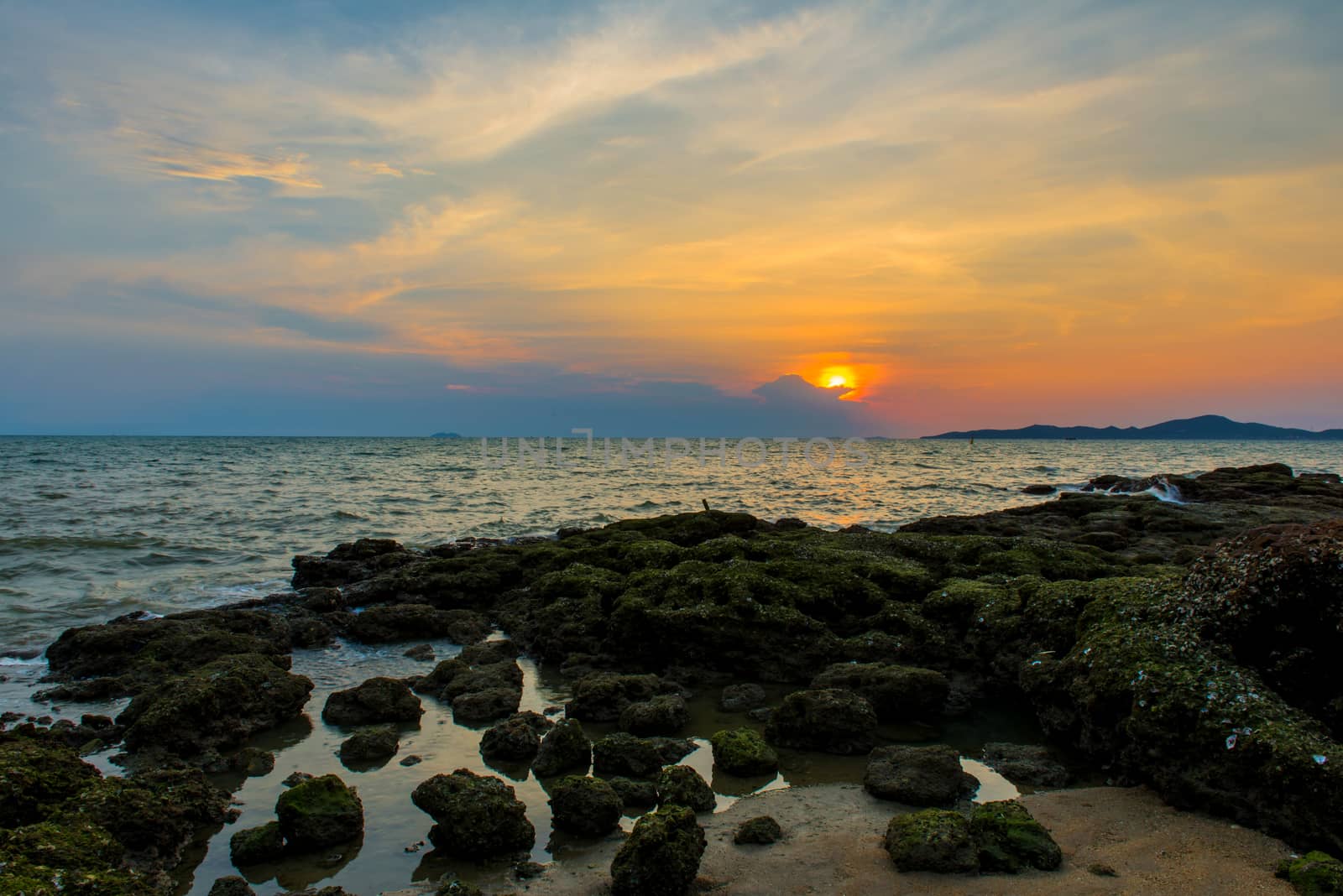 Beautiful sunset above the Tropical beach in Thailand.