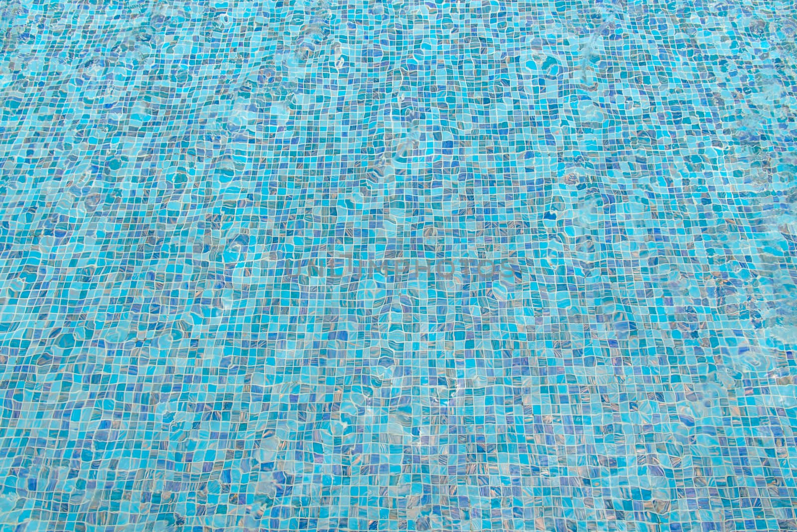 blue swimming pool with sunny reflections abstract for background.