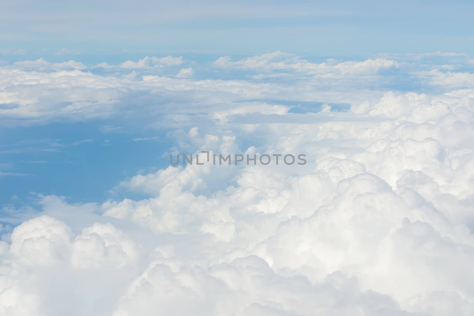 Blue sky and Clouds as seen through window of aircraft by casanowe