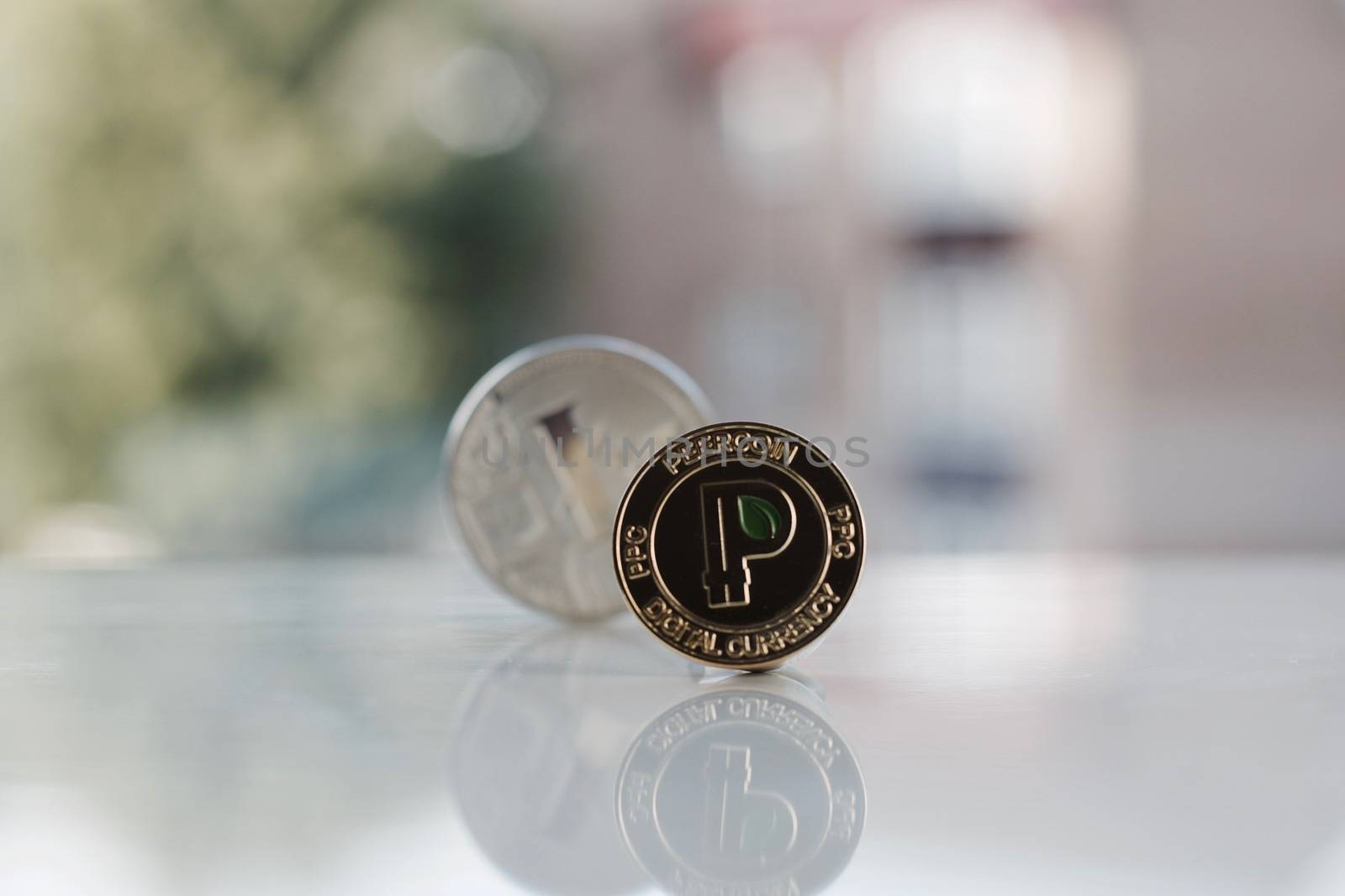 Digital currency physical gold peercoin coin near silver litecoin