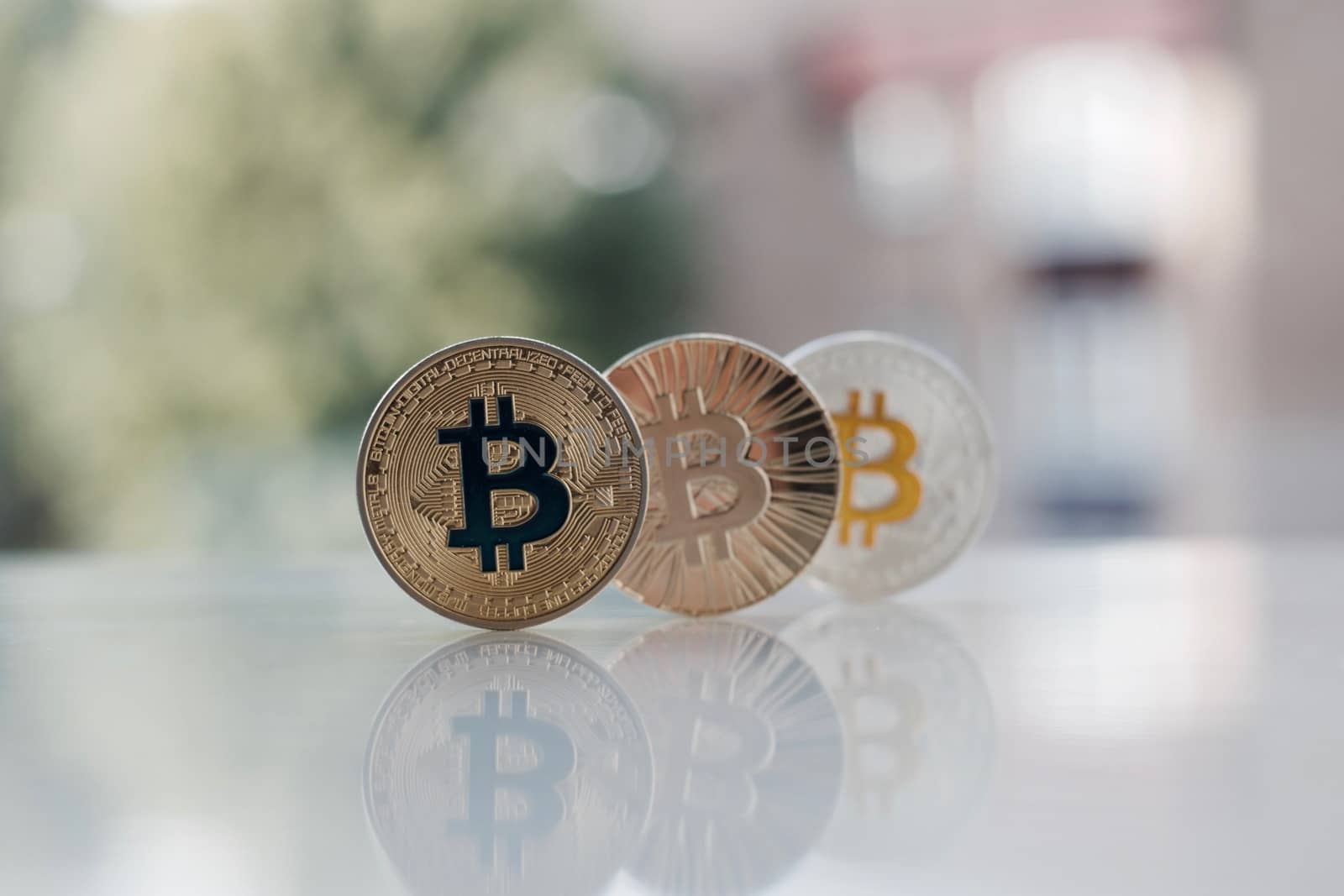 Digital currency physical gold and silver bitcoins on the table.
