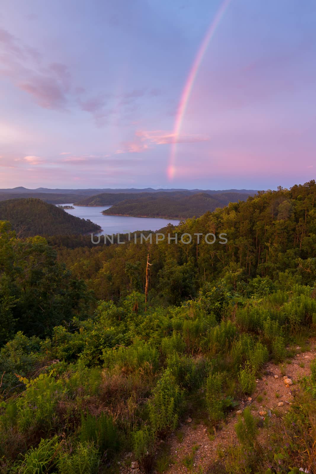 Rainbow Over Broken Bow Lake by rjamphoto