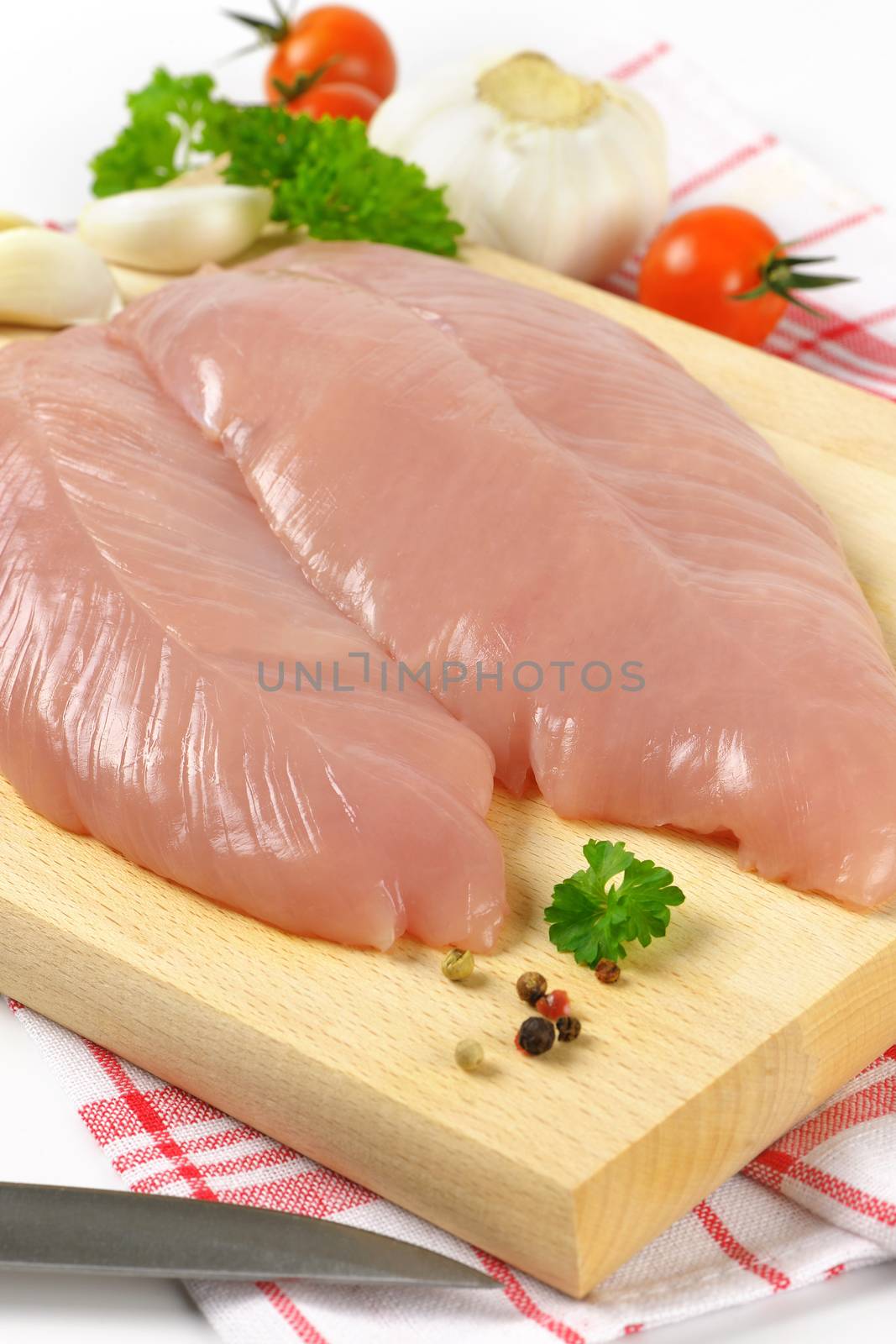 raw turkey breast fillets by Digifoodstock